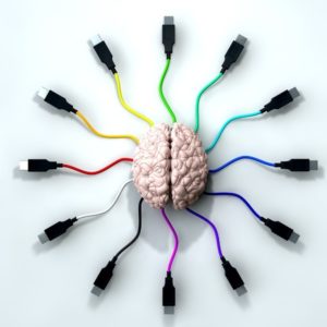 13829474 - a human brain with multi-colored usb cable extending and reaching out from its center